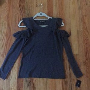 A gray open shoulder blouse